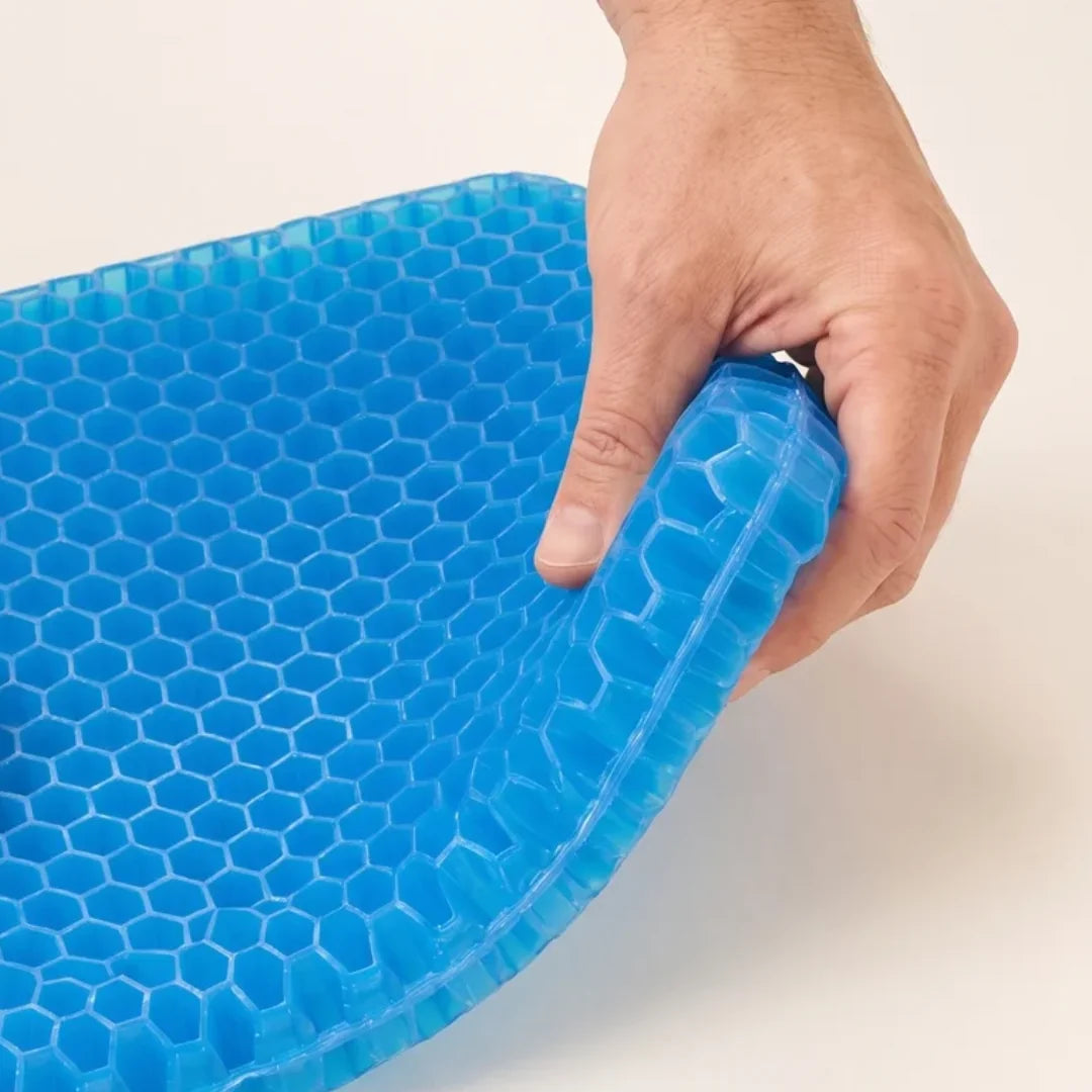 Hand gently bending a corner of the flexible blue CellGel+ cushion
